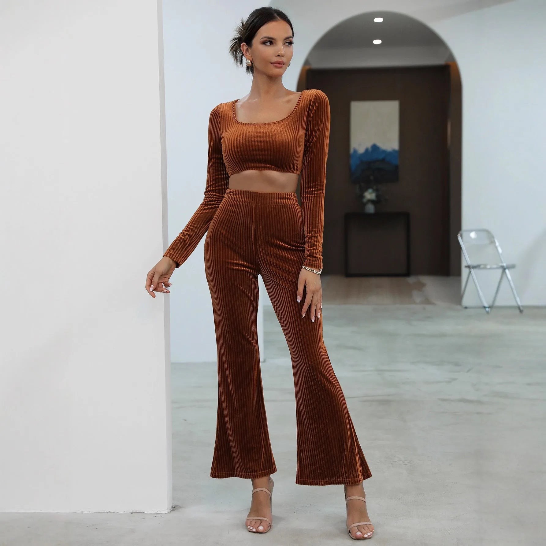 Caramel coloured long sleeve sweater and trouser casual set on a hanger.