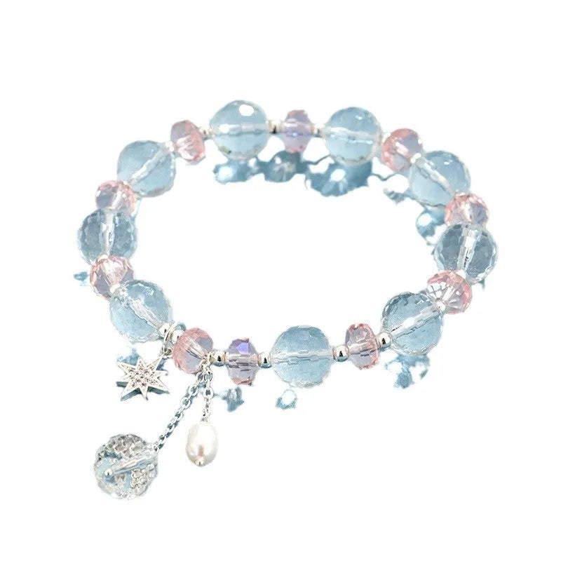 Women's white crystal bracelet with diamond-shaped beads and lucky cat charm