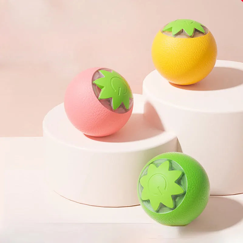 Automatic electric rolling ball pet toy for dogs and cats, 4.5cm cube in green, pink, or yellow.