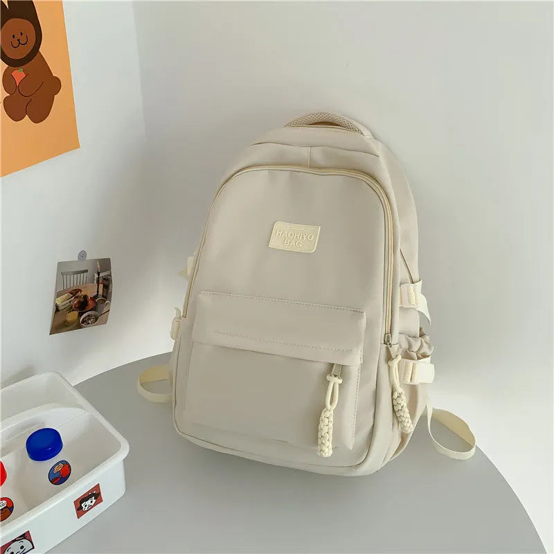 Korean-style lightweight waterproof nylon backpack for primary school students in macaron colour with curved shoulder strap, 20-35L capacity