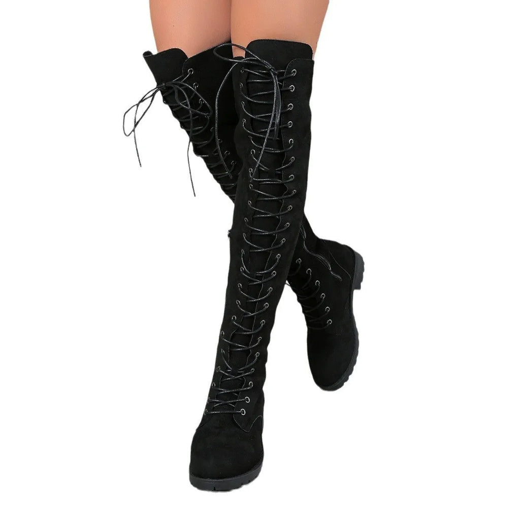 Women's black lace-up over-the-knee boots with a flat rubber sole and stitching detail.