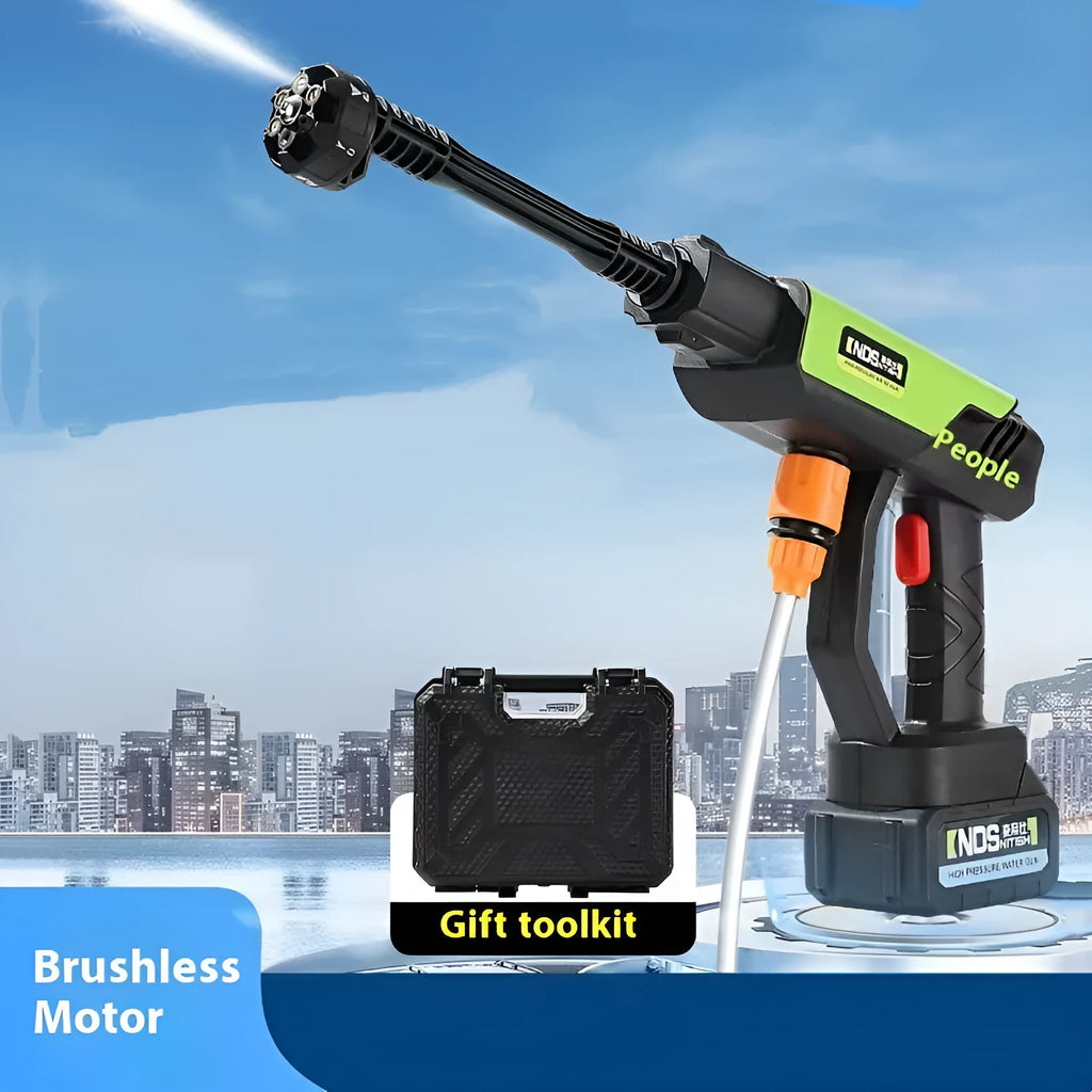 Green wireless high-pressure water gun with metal head and multiple nozzle attachments on a table