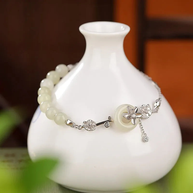 Hetian jade and 925 silver peace buckle bracelet for women in retro style.