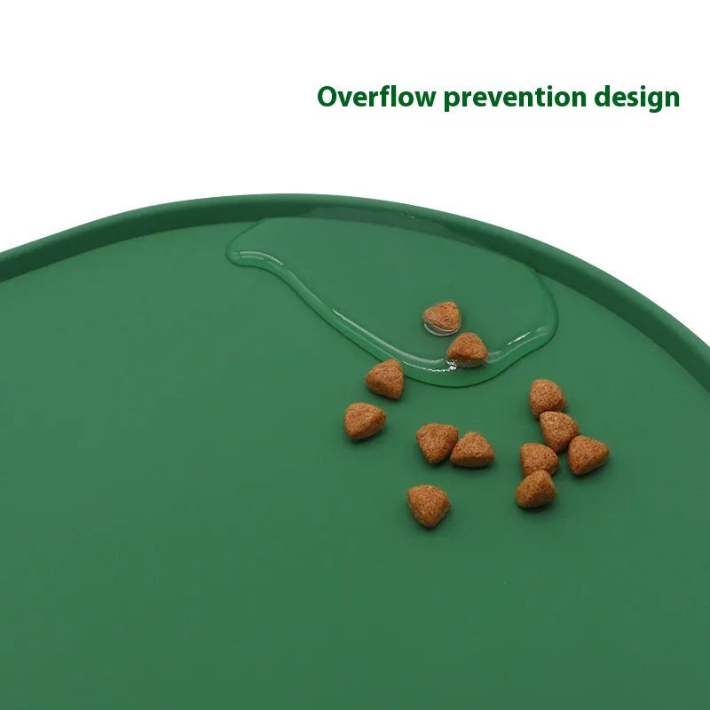 A green silicone placemat for cats with a non-slip base, shown under a food bowl.