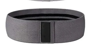 Fabric resistance band in purple, pink, and lake blue with a mesh storage bag.