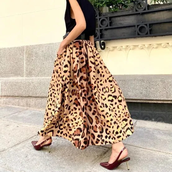 Brown leopard print women's long A-line skirt with a big hem, made from polyester fabric.