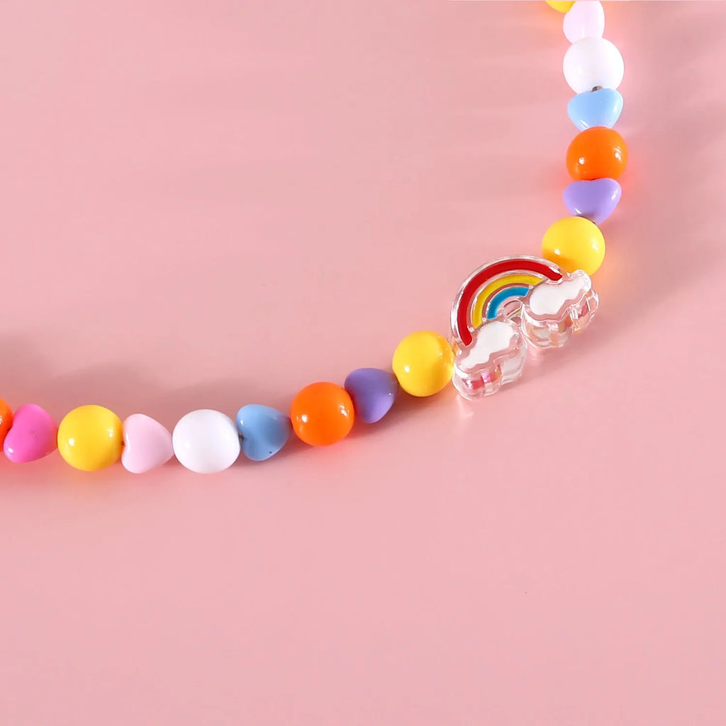 Colourful plastic bead cat necklace in small flower, rainbow or peach designs with adjustable sizing