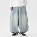 Men's plus size baggy jeans in light blue denim with wide straight legs and a low waist.