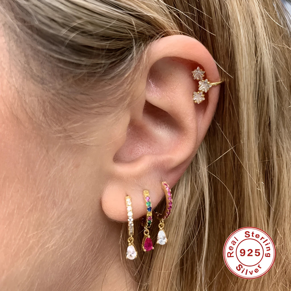 Sterling silver geometric water drop earrings with a gemstone accent on a gold or silver plated finish.