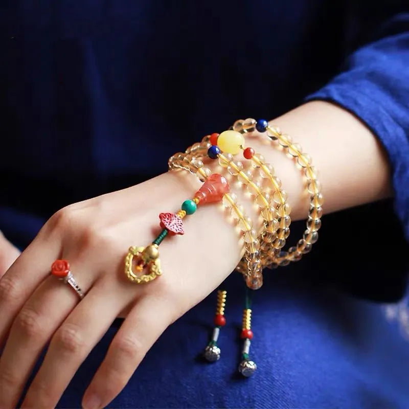 Natural Brazilian citrine bracelet with small 1mm red and yellow beads and filament accessories.