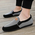 Men's grey and khaki canvas slip-on board shoes with round toe and rubber sole.