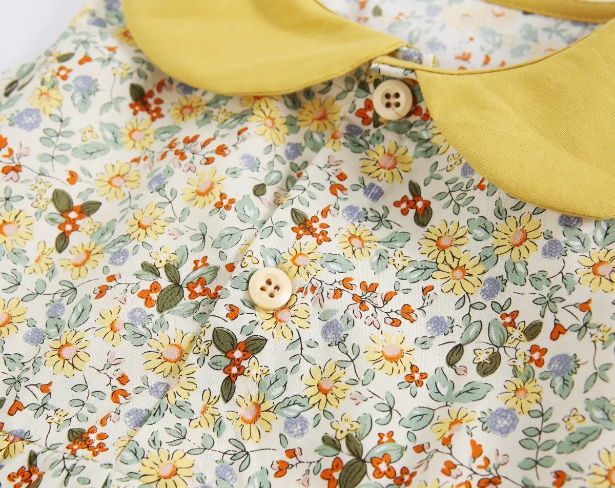 Yellow cotton floral baby romper with doll collar, triangle jumpsuit style for girls 0-6 months to 2-3 years