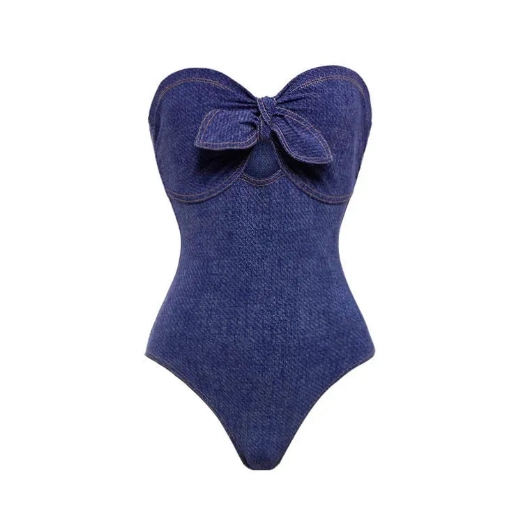 Women's vintage denim-colour one-piece swimsuit with a matching skirt laid flat.