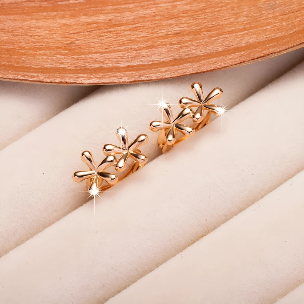 Circular rose gold earrings with a detailed waterdrop flower design for women.