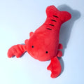 Red lobster-shaped squeaky dog toy with crab-lobster design measuring 12.5cm long