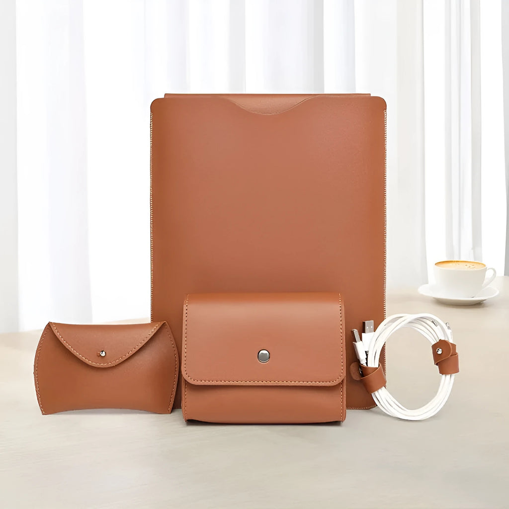 Set of four brown imitation leather laptop corner protectors on a grey laptop.