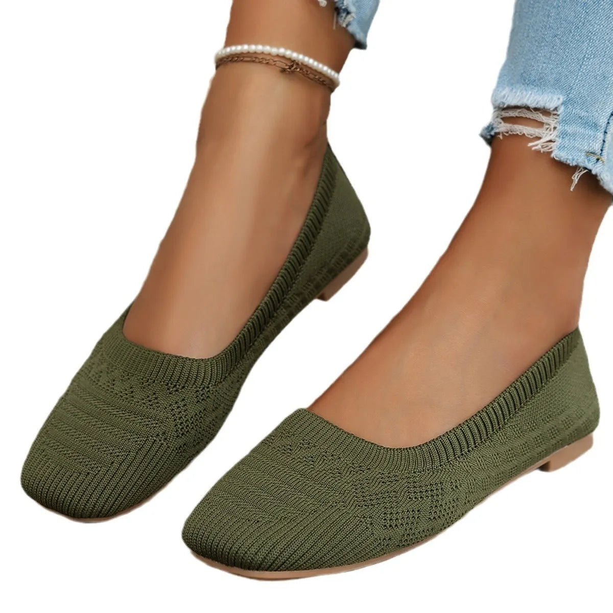 Women's knitted canvas slip-on shoes in black with flat heel and shallow mouth