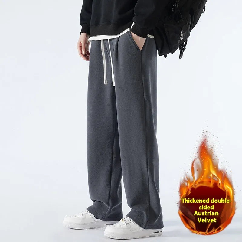 Man wearing apricot coloured loose-fit polar fleece winter sports pants with a drawstring waist.