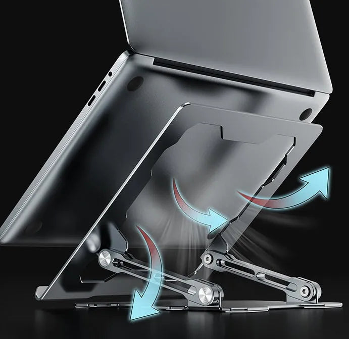 Grey portable aluminum laptop stand shown folded and in use with a silver laptop, demonstrating its adjustable angle.