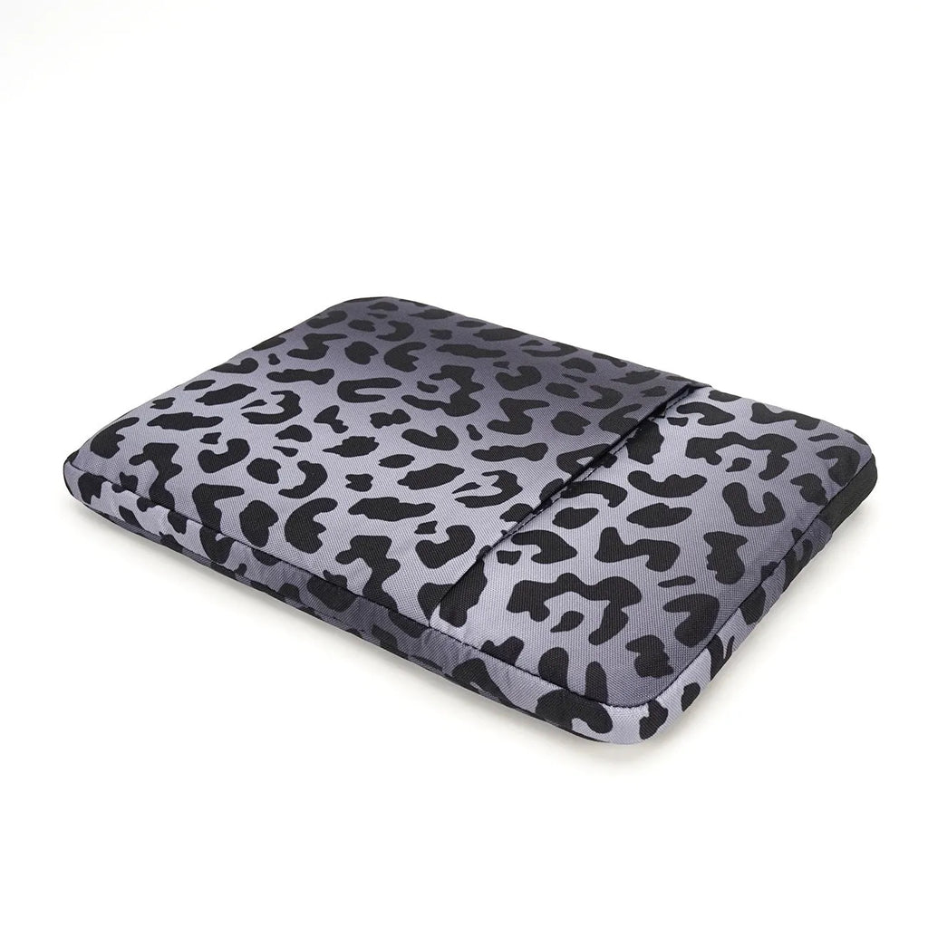 Leopard print laptop sleeve for 13-inch to 16-inch laptops with anti-shock protection.