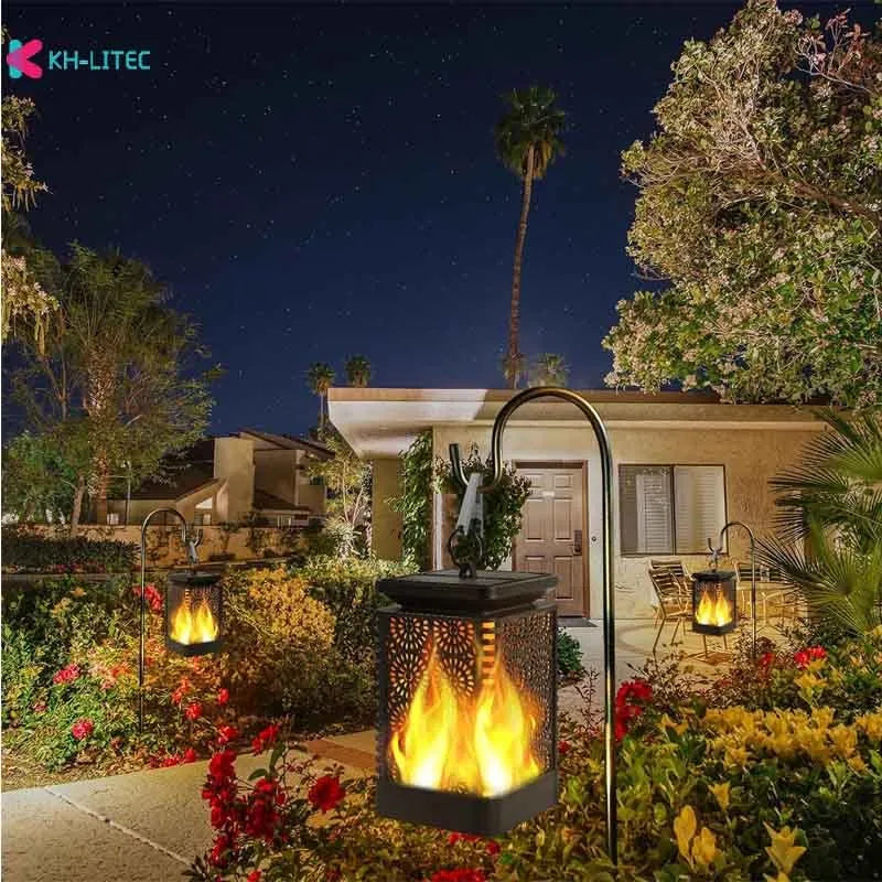 Four black solar-powered hanging lanterns with flame effect LED for garden decoration