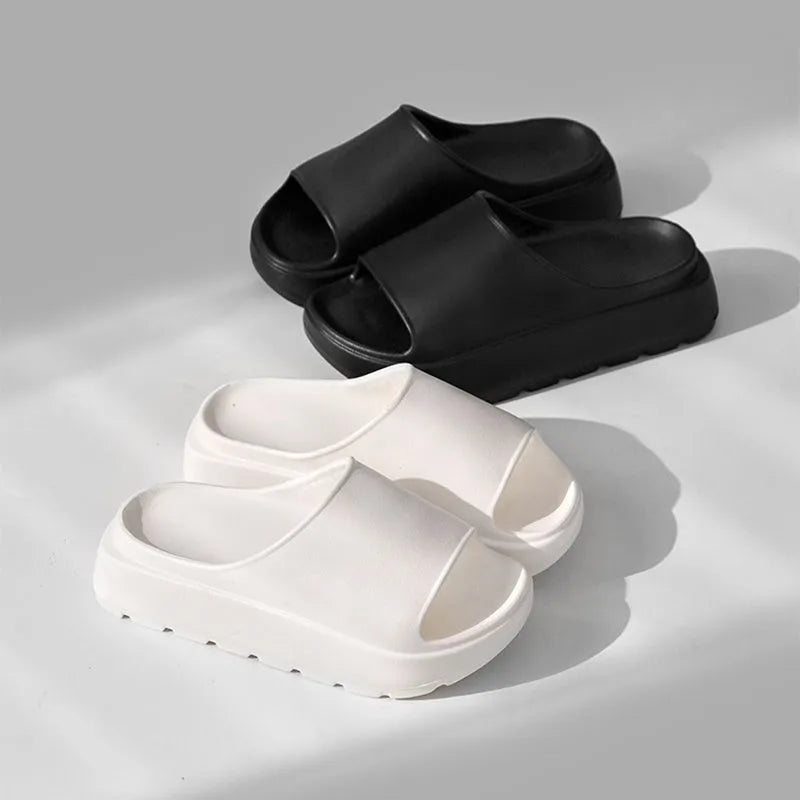 Women's thick-soled beige EVA beach slippers with a fish mouth design.
