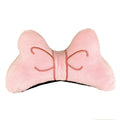 A soft plush bow decoration for helmets in red, peach pink, and rose pink colours.