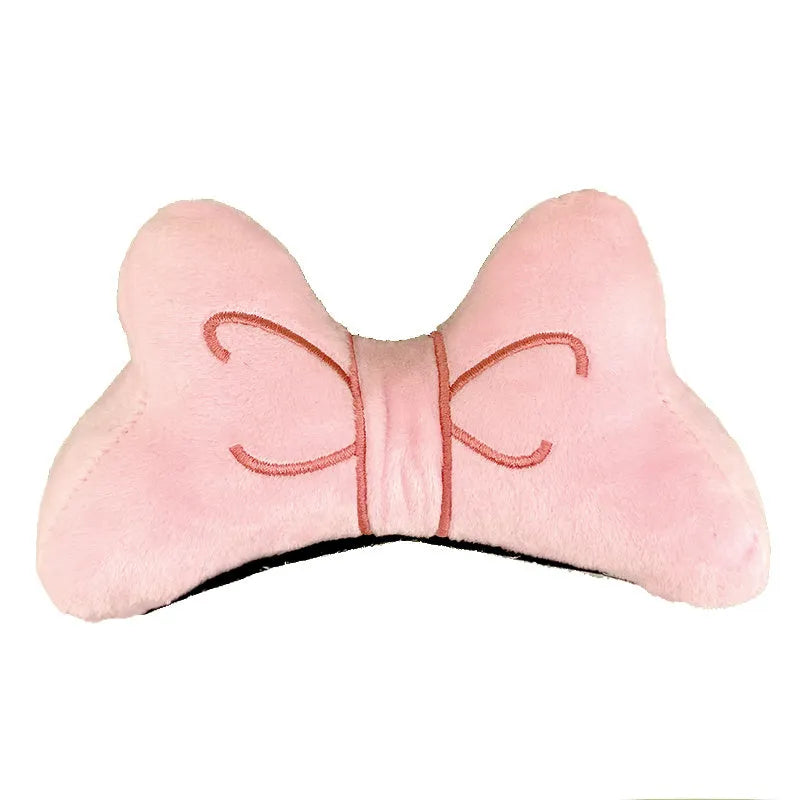 A soft plush bow decoration for helmets in red, peach pink, and rose pink colours.