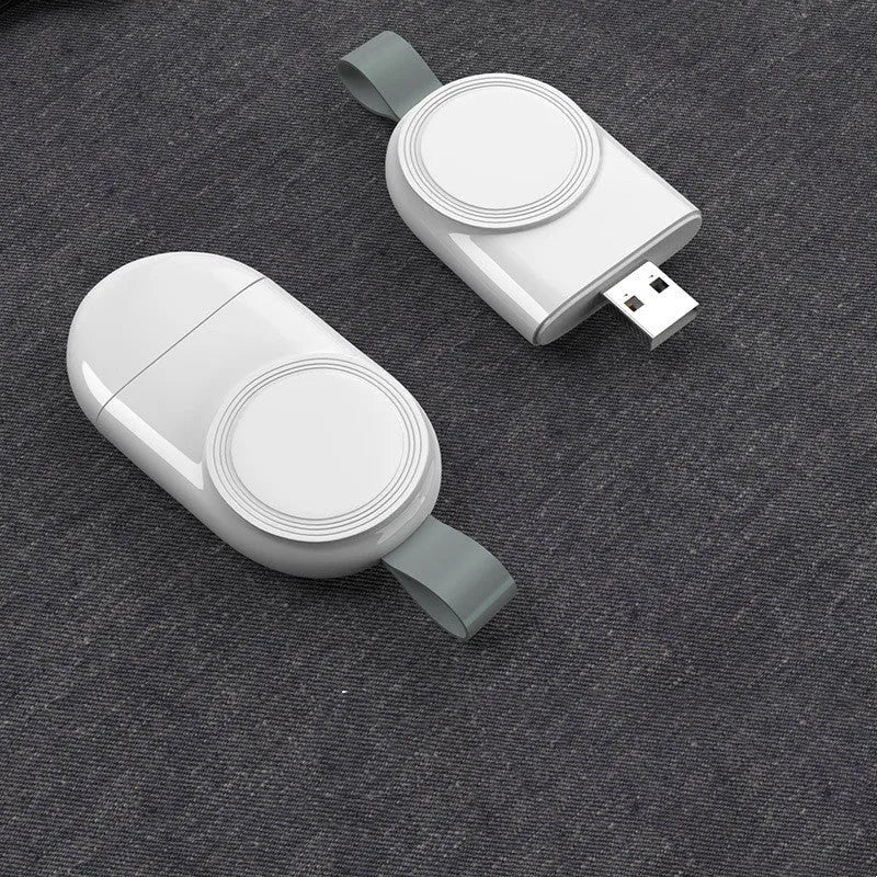 White portable wireless charging dock station for Apple Watch with USB cable.