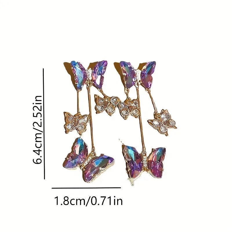 A pair of blue purple butterfly coloured alloy earrings with crystal flowers and a drop tassel.