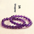 Natural amethyst scattered bead bracelet on a single strand, showing polished crystal stones.