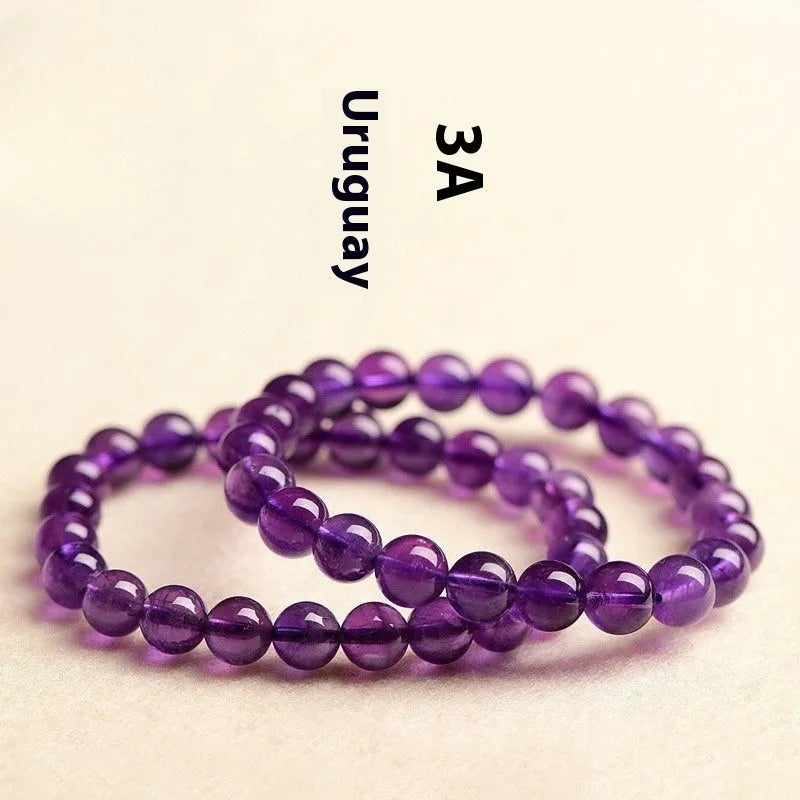 Natural amethyst scattered bead bracelet on a single strand, showing polished crystal stones.