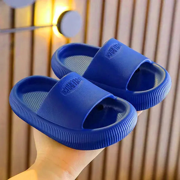 Children's bright coloured EVA slippers with a thick non-slip sole on a white background.