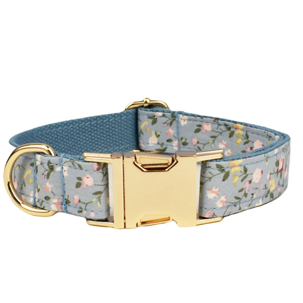 Blue floral dog accessory set with collar, leash, vest, bow tie and poop bag holder