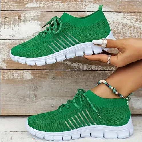 Women's breathable high-cut lace-up casual sneaker on a flat platform heel with a rubber sole.