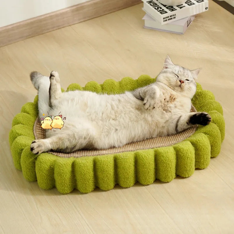 Green oval cat scratch pad bowl bed with sisal scratching surface measuring 650mm by 420mm