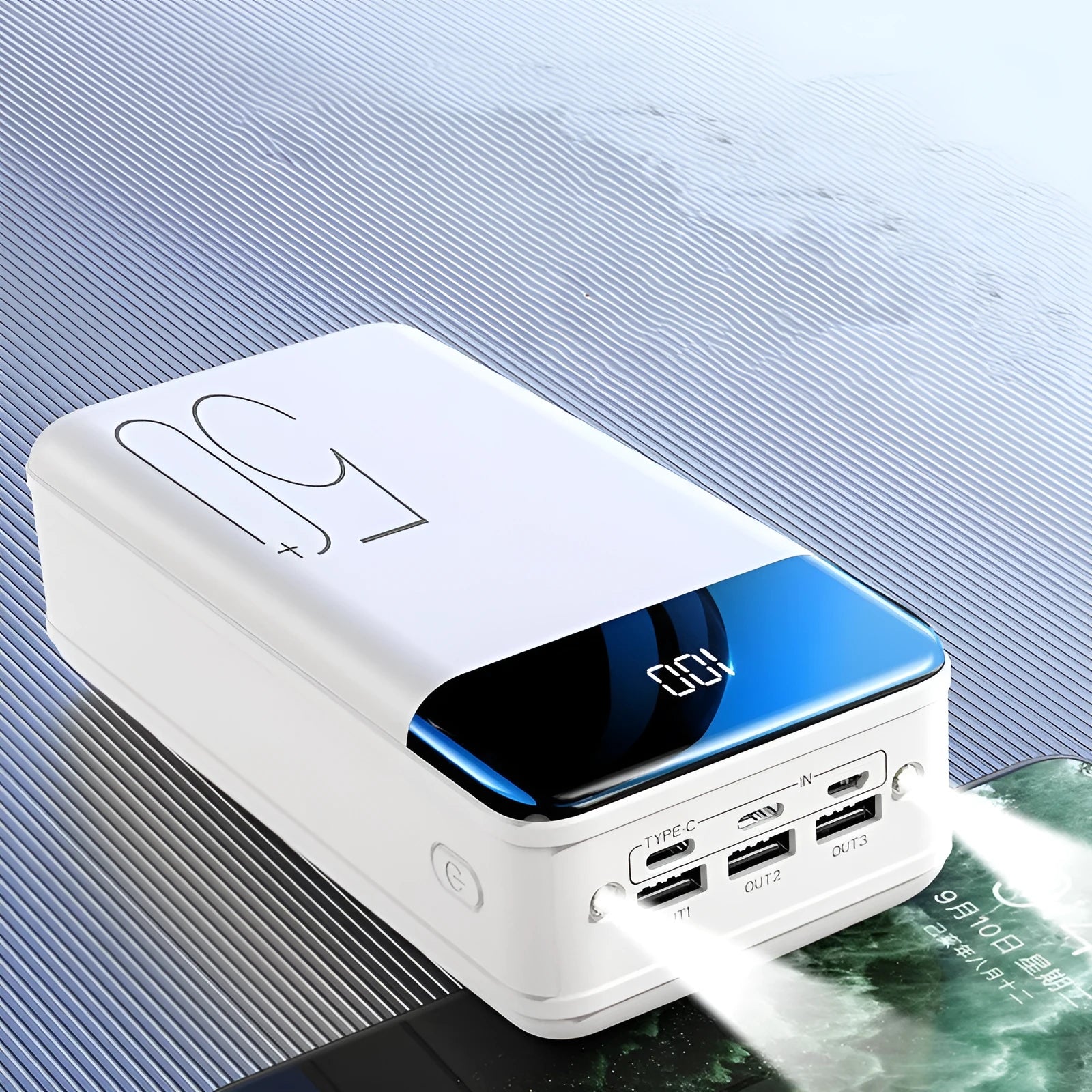Black and white large capacity 50000mAh power bank with multiple USB ports.
