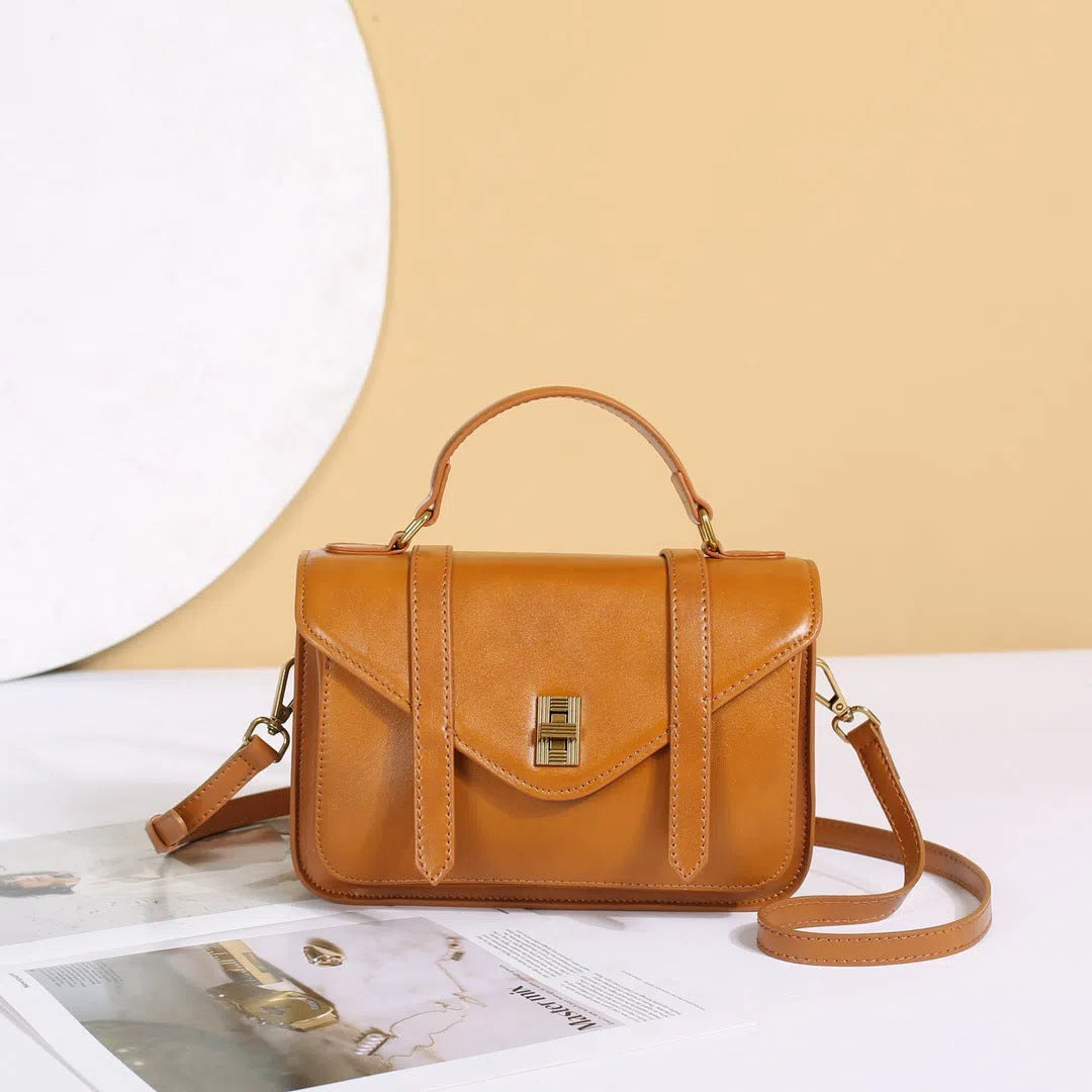 Full-grain vegetable-tanned cowhide tote bag in horizontal rectangular shape with double shoulder straps, large capacity interior, available in five colours