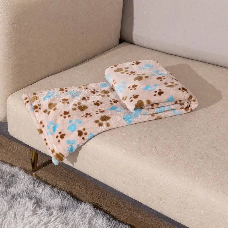 Blue cartoon dog pattern on a double-sided thickened flannel pet blanket laid flat.