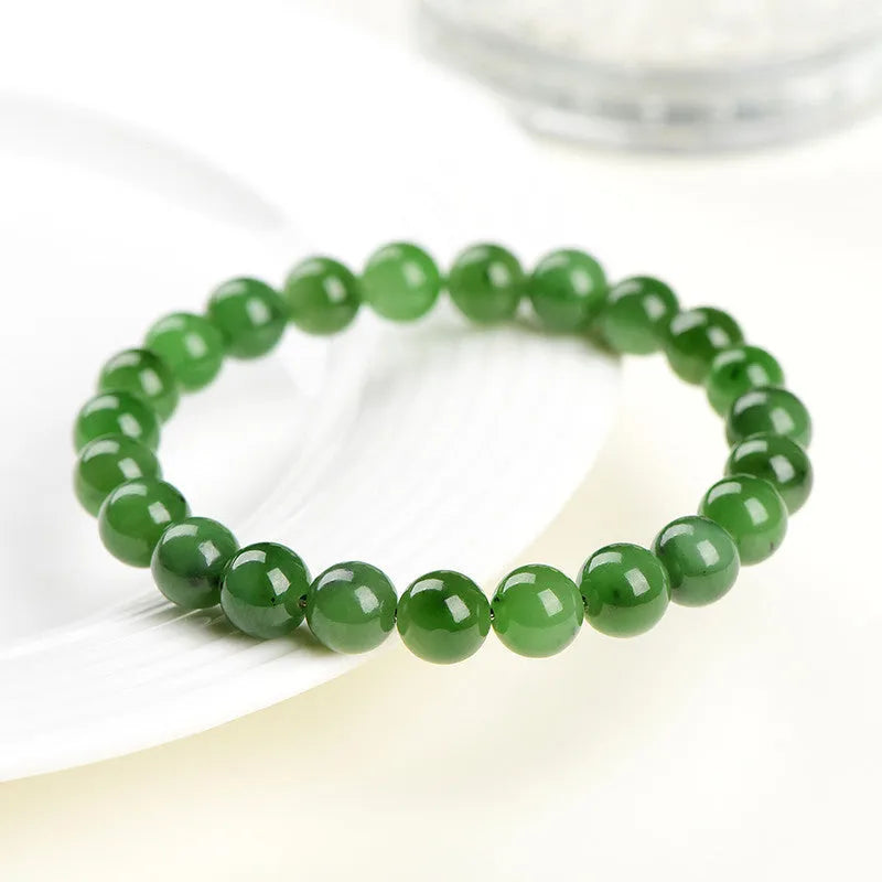 Natural Hetian jade ball bracelet with polished beads, shown in Jasper stone colour variations.