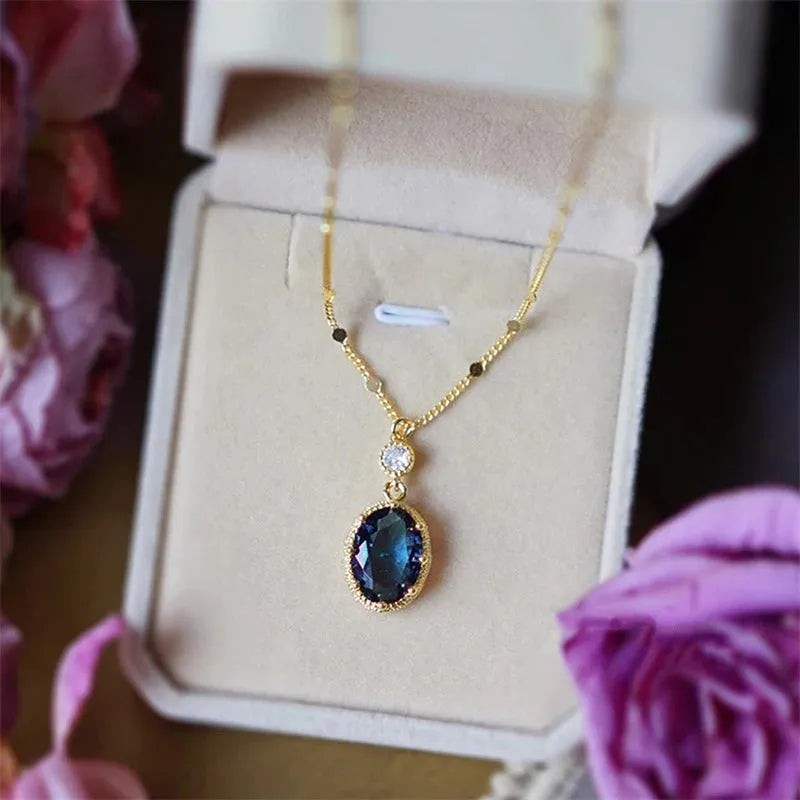Gold geometric pendant necklace on a model, showcasing French retro design.