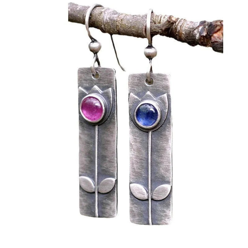 Antique finish red sapphire earrings with geometric shape and elliptic design elements