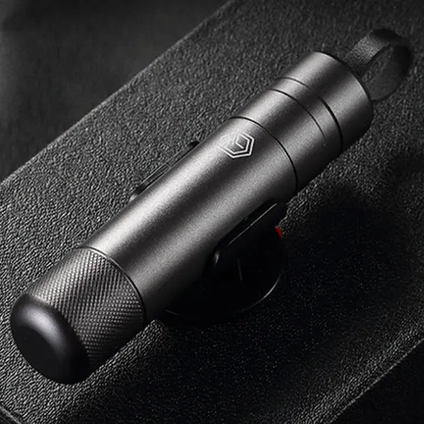 Gun grey aluminium alloy automobile safety hammer with belt cutter on a 3M rubber base.