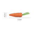 Assortment of interactive cat toys including carrot-shaped paper toys, ringing stones, and cat sticks in two sizes