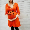 Halloween orange cotton maternity dress on a hanger