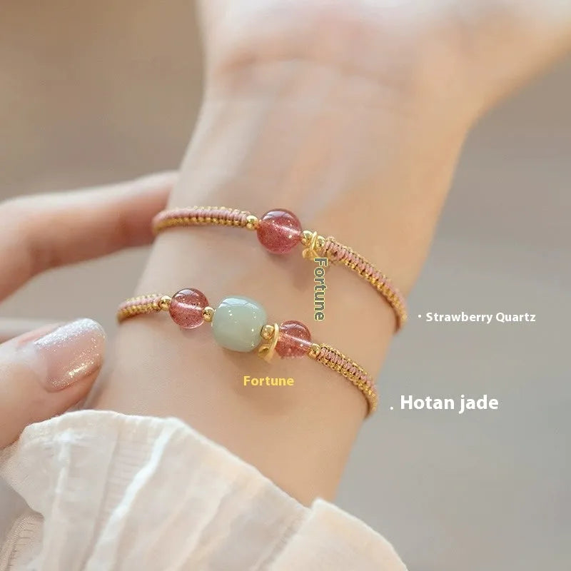 Adjustable red rope bracelet with sliding strawberry quartz bead in national tide style.