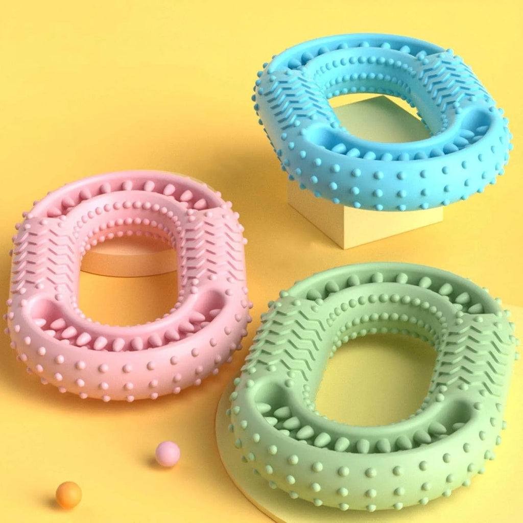 Blue O-ring shaped dog chew toy for aggressive chewers and dental care on a white background.