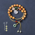 Hand-woven ebony bracelet with double ring design and traditional ruyi elements