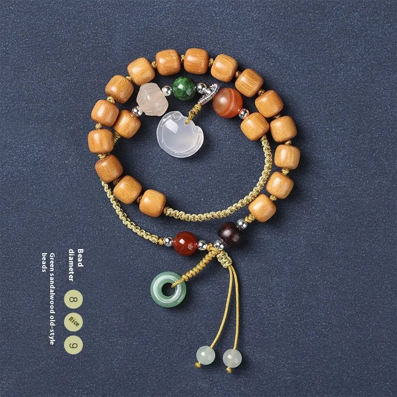 Hand-woven ebony bracelet with double ring design and traditional ruyi elements