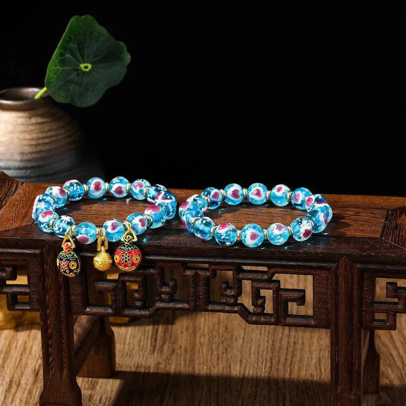 Handmade fluorescent glaze bracelet with swallowing gold beast motif on heart-shaped 10mm beads